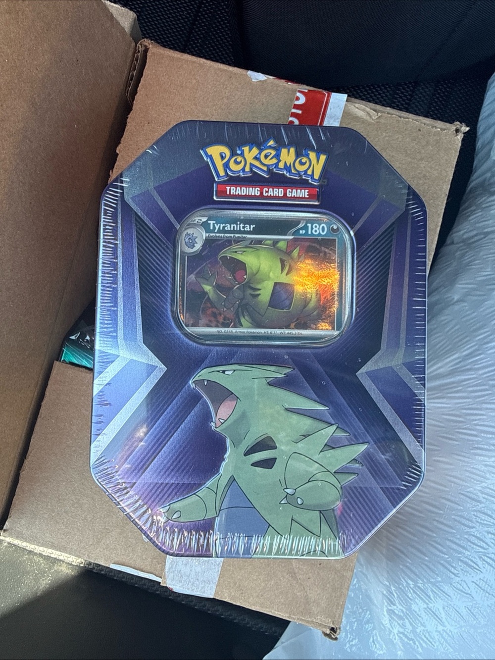 Lot Of 12 - Pokemon TCG 2024 Tyranitar Metal Tin with 3 Foil Cards 3 Boosters